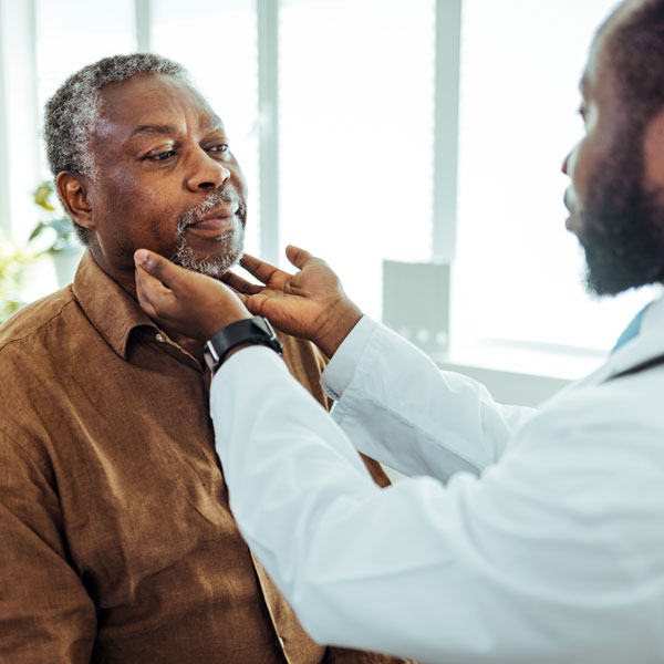 doctor examining senior male patient in Jeffersonville, Kentucky medical office