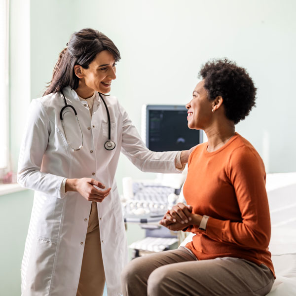 doctor speaking with patient in exam room in Louisville, KY