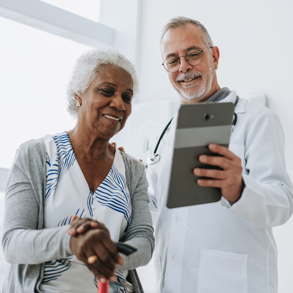 Doctor reviewing records with patient in Louisville, KY