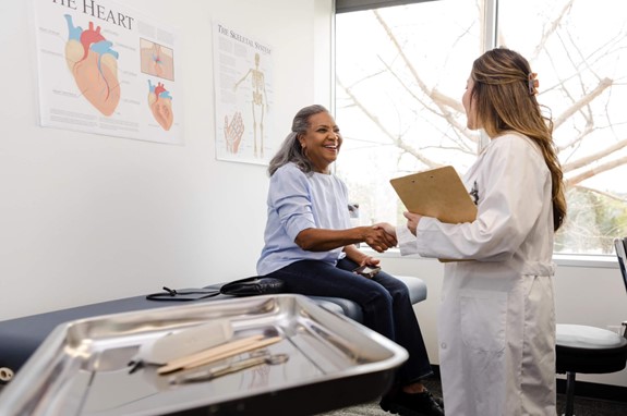 a person shaking hands with a doctor